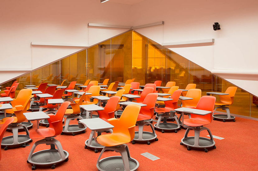 Classroom in the Ryerson Learning Centre with orange furniture and orange glass walls